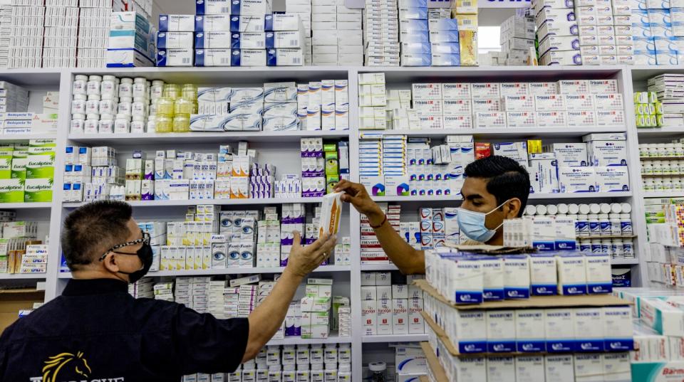 Workers retrieve abortion medication at a pharmacy in Nuevo Progreso, Mexico.