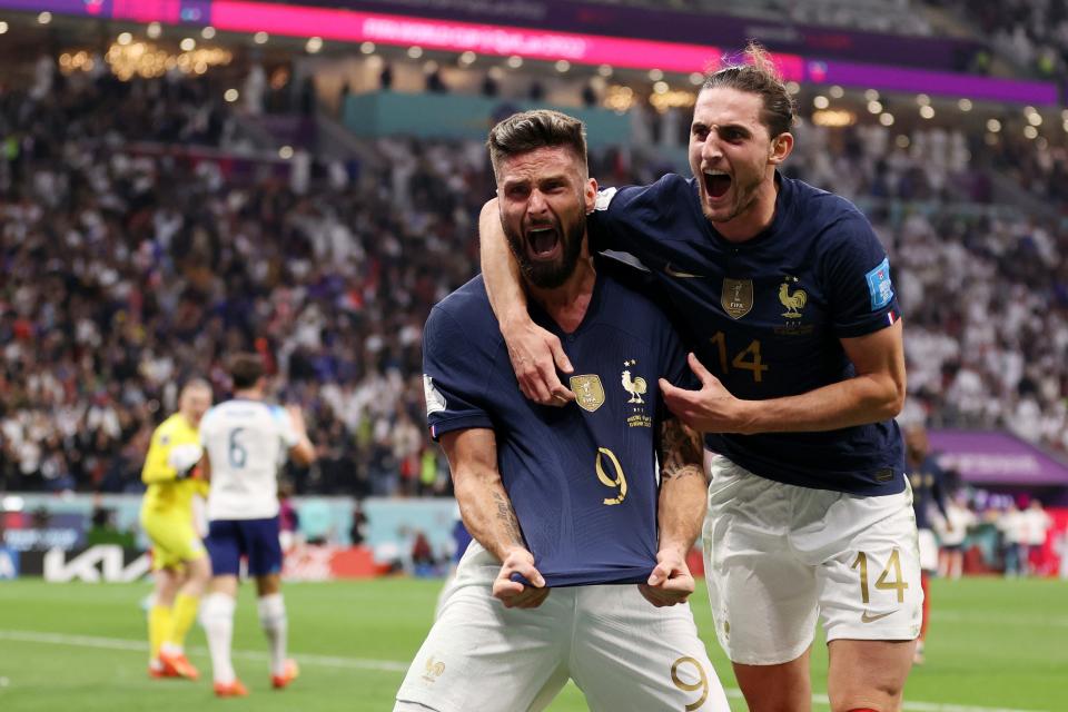Olivier Giroud (left) celebrates after scoring the team's second goal against England in their quarterfinal match.