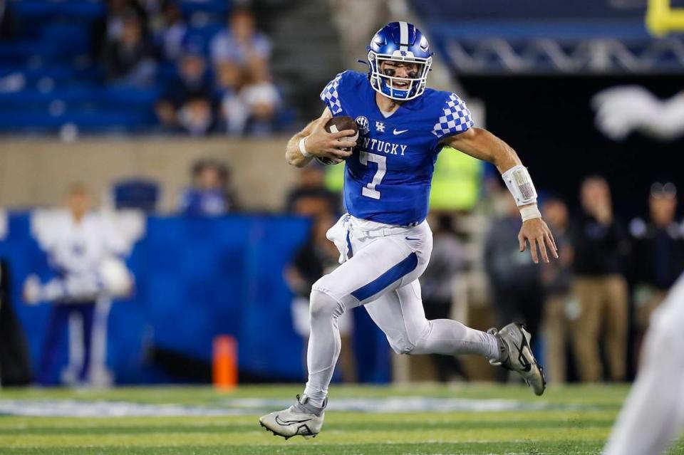 Kentucky quarterback Will Levis runs with the ball against Northern Illinois during Saturday’s game at Kroger Field.
