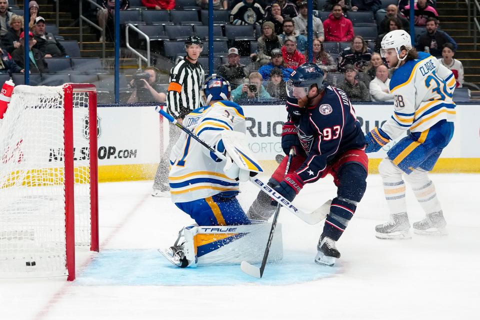Sep 28, 2022; Columbus, Ohio, USA;  Columbus Blue Jackets right wing Jakub Voracek (93) scores past Buffalo Sabres goaltender Eric Comrie (31) during the third period of the NHL preseason hockey game at Nationwide Arena. Mandatory Credit: Adam Cairns-The Columbus Dispatch