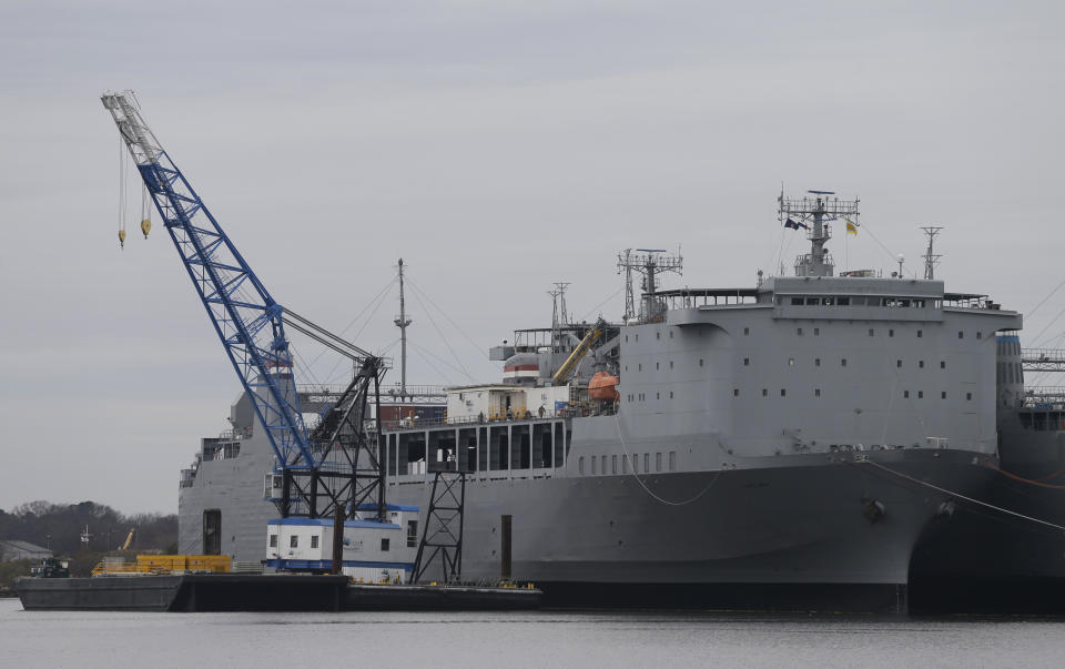 FILE - This Thursday, Jan. 2, 2014, file photo, shows a barge anchored alongside the MV Cape Ray in Portsmouth, Va. The American ship MV Cape Ray is set to arrive Thursday, Feb. 13, 2014, at the naval base of Rota on Spain’s southwestern coast used by the U.S. to resupply ahead of an unprecedented mission to collect and destroy mustard gas, raw materials for sarin nerve gas and tons of other highly toxic chemicals that form part of Syria’s chemical weapons program. (AP Photo/Steve Helber, File)