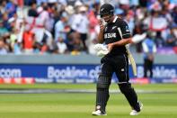 De Grandhomme walks back to the pavilion after a shakey innings. (Photo by Paul ELLIS / AFP)