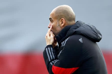 Bayern Munich's coach Pep Guardiola conducts a training session in Munich November 24, 2014. REUTERS/Michael Dalder