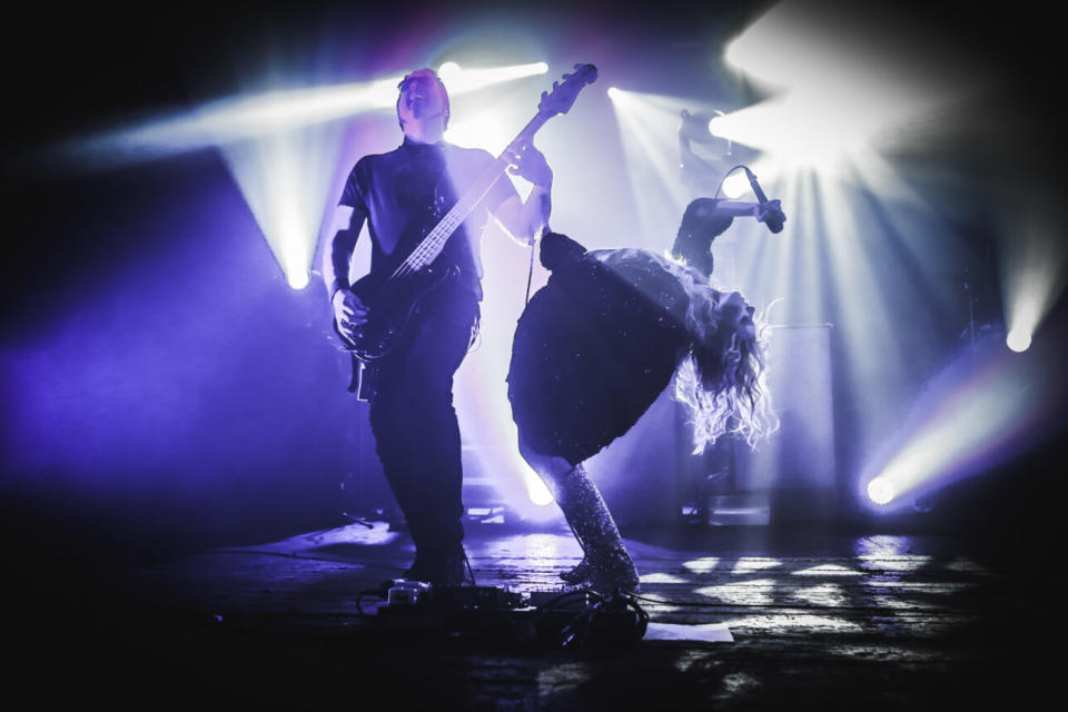 Bassist Mark Damon, Taylor Momsen and the band on stage at London’d Brixton Academy on November 26, 2014. (Credit: Christie Goodwin/Redferns via Getty Images)