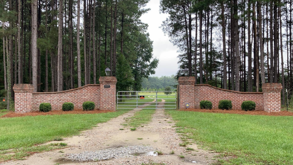 FILE - The gates near Alex Murdaugh's home in Islandton, S.C., are seen on Sept. 20, 2021. The shooting deaths of South Carolina lawyer Alex Murdaugh's wife and son started a chain of investigations, strange happenings and legal maneuvers over the past 13 months that his lawyer said in July 2022, will lead to murder charges soon. (AP Photo/Jeffrey Collins, File)