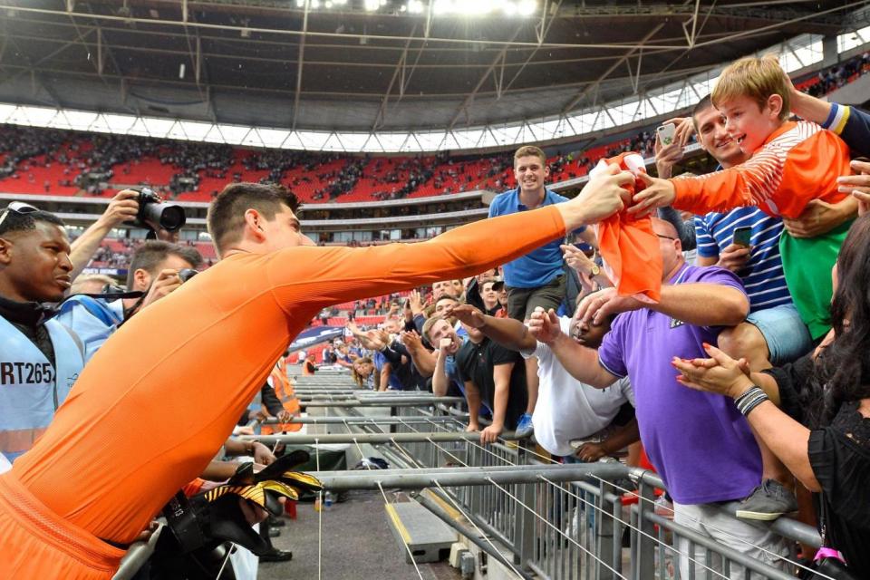 Delight | The Chelsea goalkeeper hands his shirt over to a boy in the travelling end (Getty)