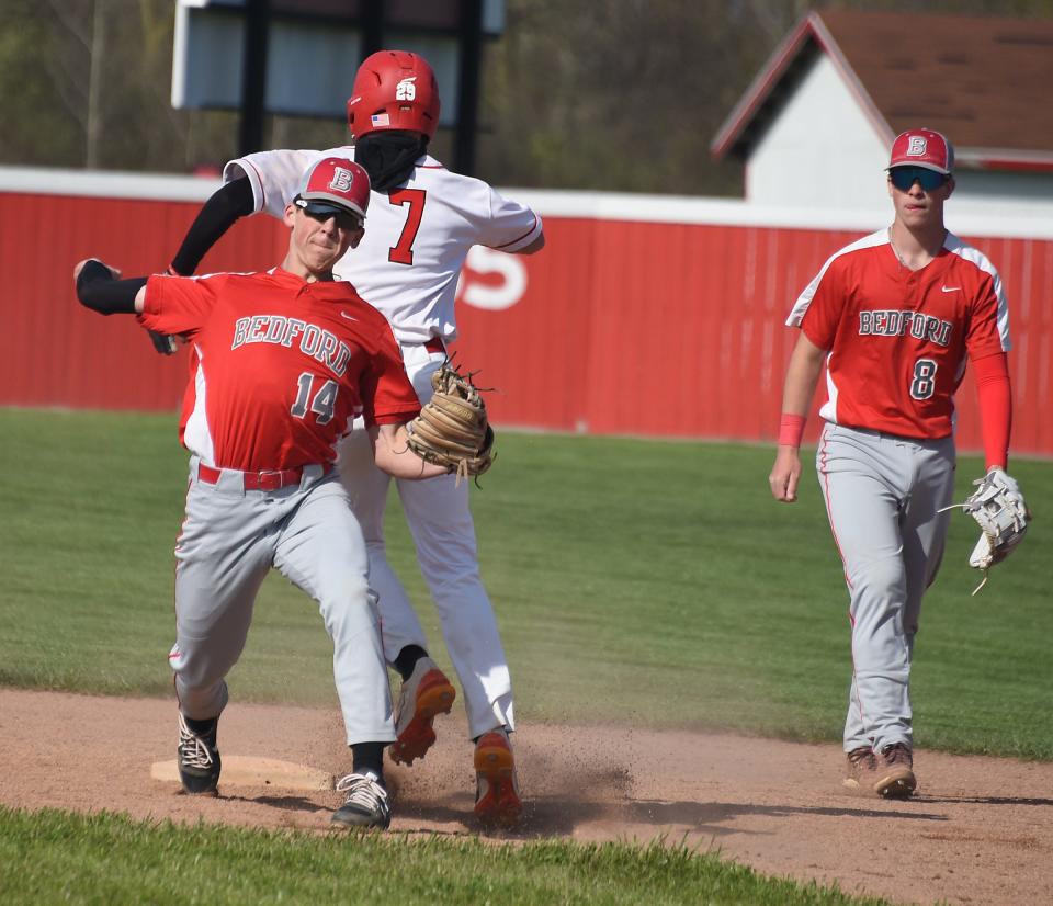 Bedford shortstop Jace Bloomer takes care of a double play as Jax Jones of Monroe out at second Monday, April 22, 2024.