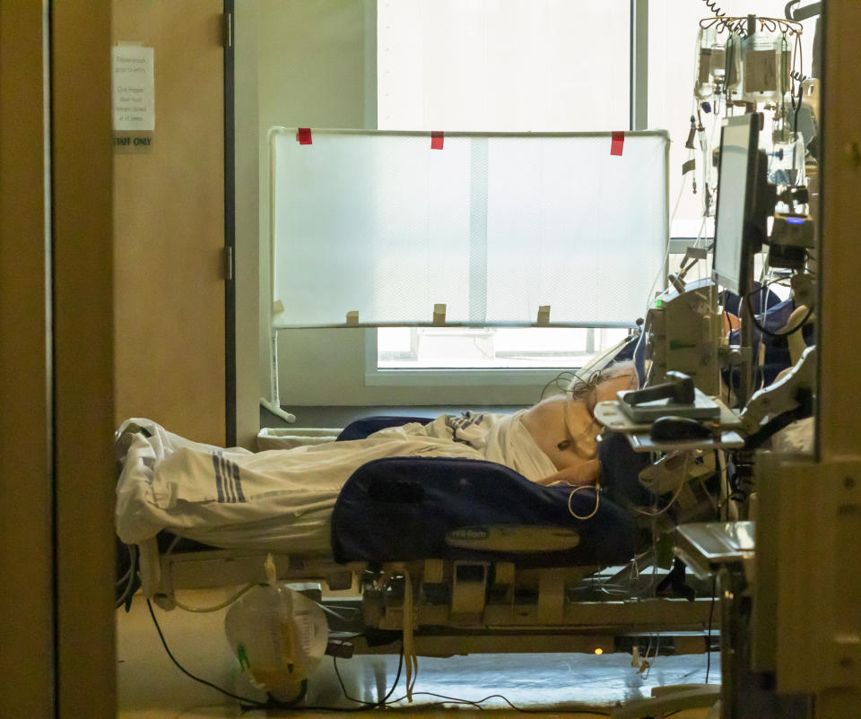 In this Thursday, Aug. 19, 2021, photo, an unidentified patient is monitored at the Critical Care Unit at Asante Three Rivers Medical Center in Grants Pass, Ore. The hospitalization rate of unvaccinated COVID-19 is breaking records and squeezing hospital capacity, with several running out of room to take more patients.(Mike Zacchino/KDRV via AP, Pool)