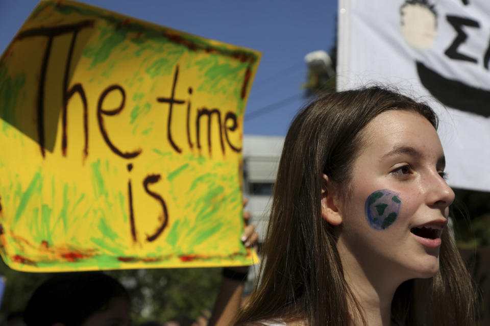 Protesters demonstrate in front of Cyprus' Parliament building in Nicosia, Cyprus, Friday, Sept. 20, 2019. Protesters around the world joined rallies on Friday as a day of worldwide demonstrations calling for action against climate change began ahead of a U.N. summit in New York. (AP Photo/Petros Karadjias)