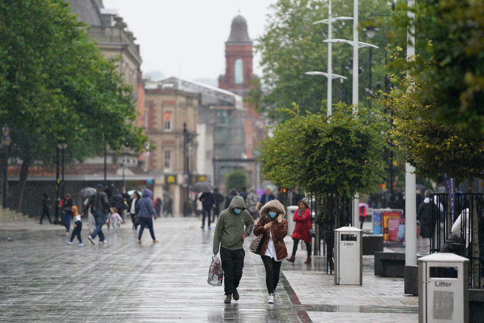 GREATER MANCHESTER, Sept. 2, 2020-- People walk on the street in Bolton, Greater Manchester, Britain on Sept. 2, 2020. According to BBC, parts of Greater Manchester will not have lockdown restrictions eased as planned following a government U-turn. Measures in Bolton and Trafford were due to be eased overnight after a fall in cases earlier in August. But they will "now remain under existing restrictions" following "a significant change in the level of infection rates over the last few days", the government announced.(Photo by Jon Super/Xinhua via Getty) (Xinhua/Jon Super via Getty Images)