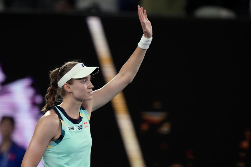 Elena Rybakina of Kazakhstan waves after defeating Karolina Pliskova of the Czech Republic in their first round match at the Australian Open tennis championships at Melbourne Park, Melbourne, Australia, Tuesday, Jan. 16, 2024. (AP Photo/Andy Wong)