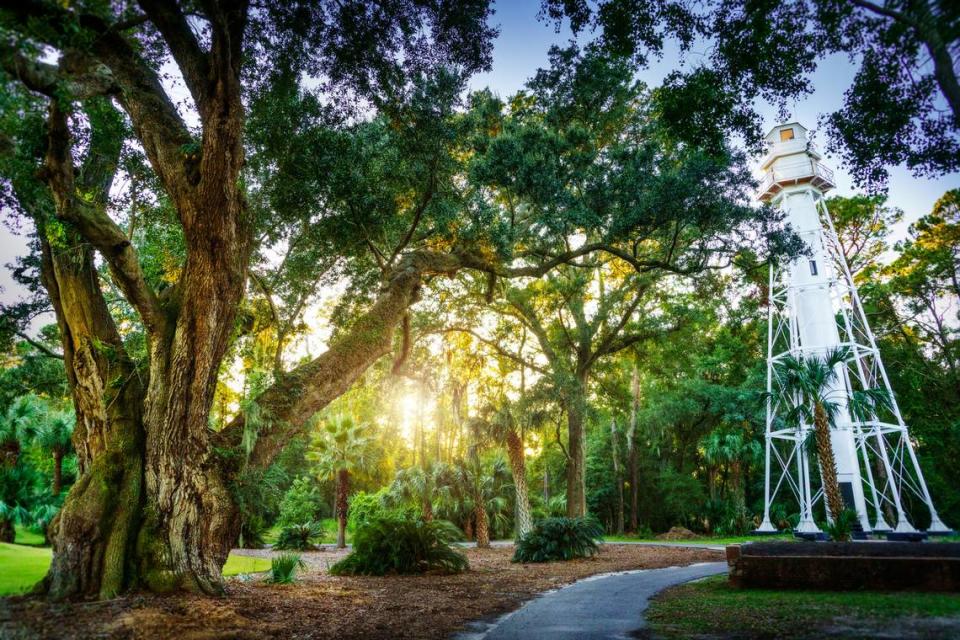 Hilton Head Rear Range Lighthouse, located in the Leamington area of Palmetto Dunes Oceanfront Resort, next to a massive live oak tree estimated to be one of the oldest on Hilton Head.