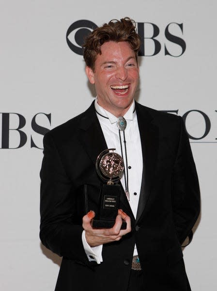 Levi Kreis holds his 2010 Tony Award for best performance by a featured actor for his role in "Million Dollar Quartet."