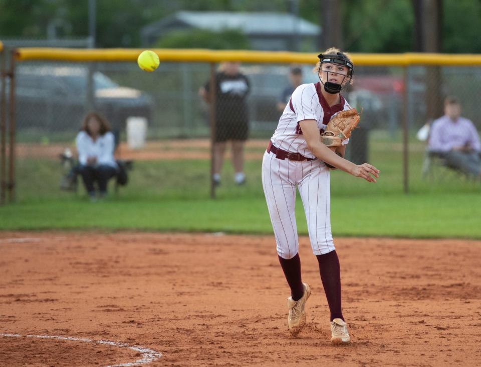 Shortstop Harmony  Stafford (3) throws to first for an out during the Gulf Breeze vs Navarre softball game at Navarre High School on Tuesday, April 26, 2022.