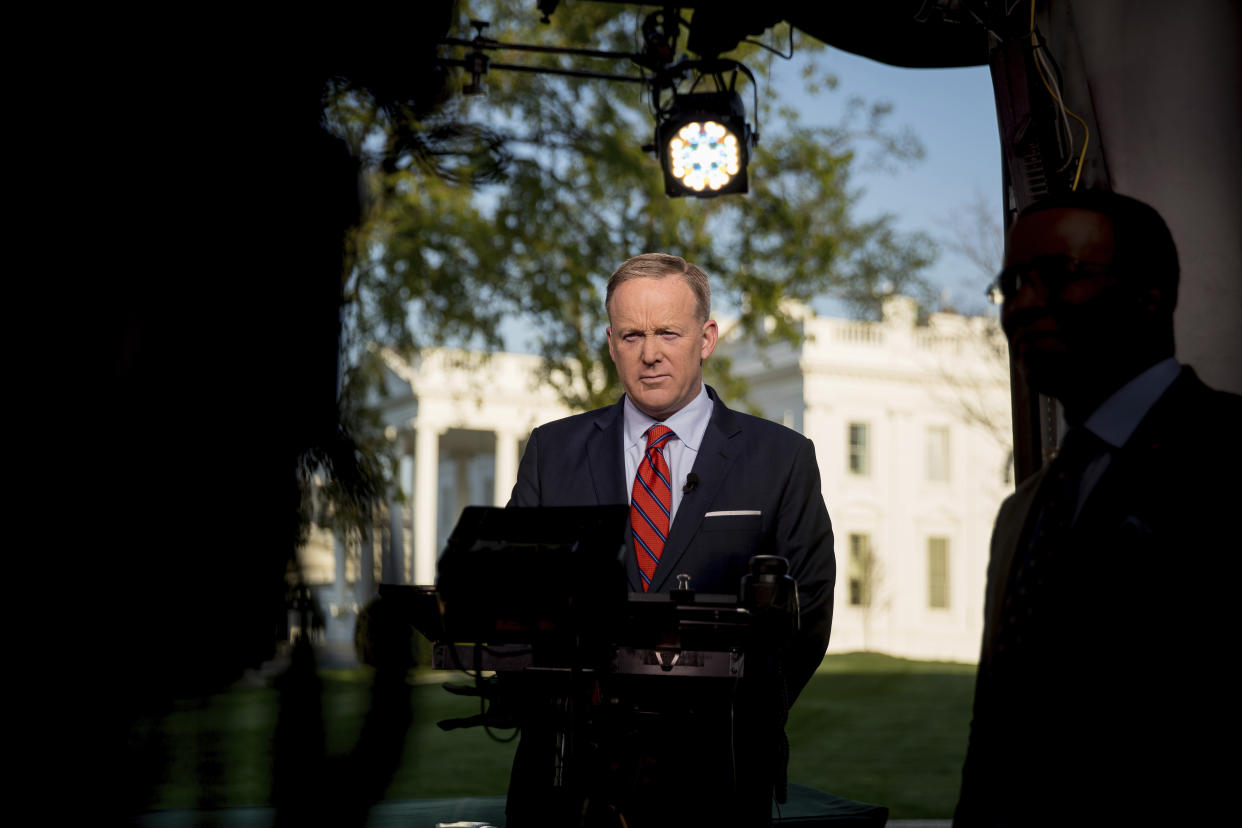 Sean Spicer prepares to go on cable news on the North Lawn of the White House on April 11. Spicer apologized for making an “insensitive” reference to the Holocaust in earlier comments about Syrian President Bashar Assad’s use of chemical weapons. (Photo: Andrew Harnik/AP)