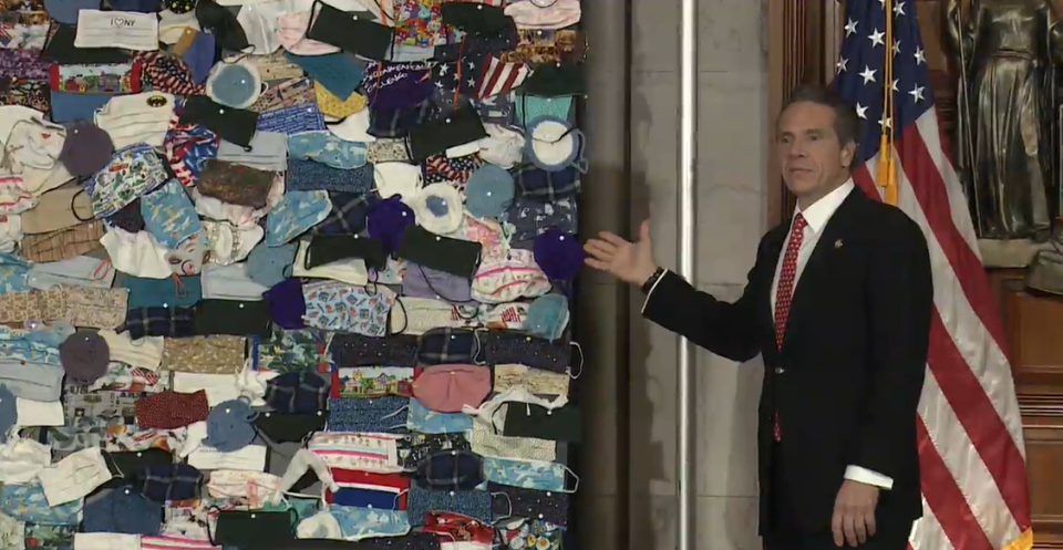 Gov. Andrew Cuomo displayed a mural of donated masks from across the country to New York during a coronavirus briefing on April 29. 2020.