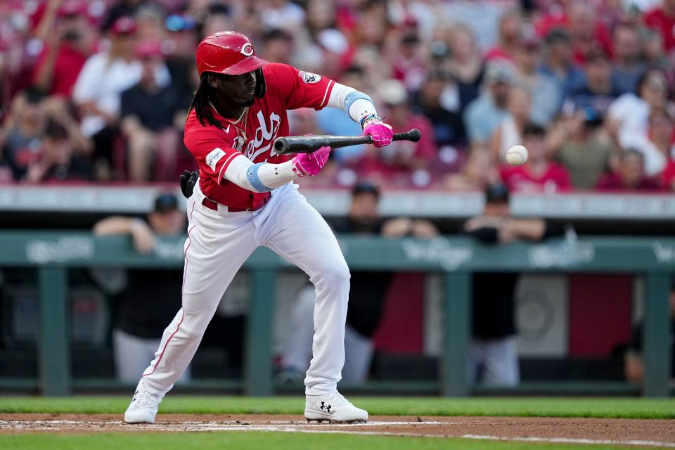 Elly De La Cruz attempts a bunt in the first inning against the Marlins at Great American Ball Park on Aug. 08, 2023.