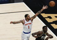 New York Knicks' Obi Toppin (1) scores against Atlanta Hawks' Clint Capela (15) during the first half in Game 4 of an NBA basketball first-round playoff series Sunday, May 30, 2021, in Atlanta. (AP Photo/Brynn Anderson)