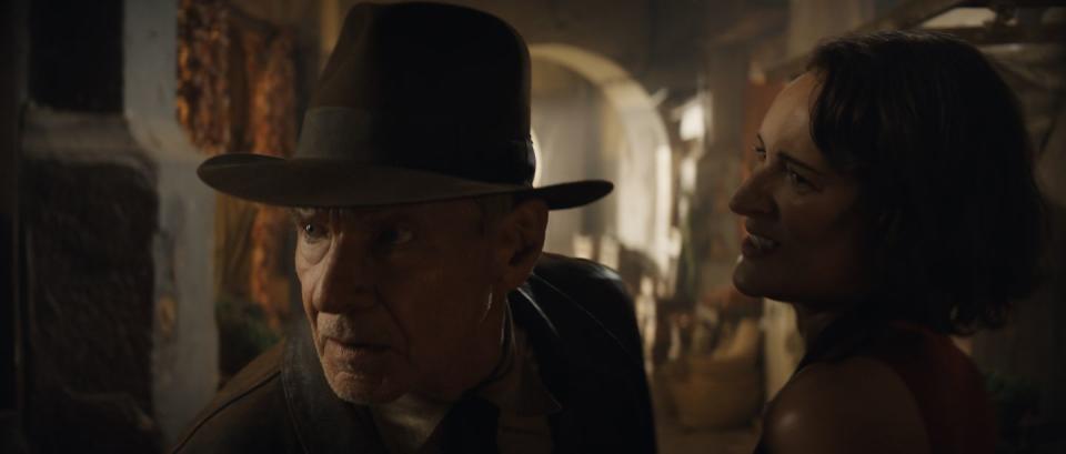 l r indiana jones harrison ford and helena phoebe waller bridge in lucasfilm's indiana jones and the dial of destiny ©2022 lucasfilm ltd tm all rights reserved