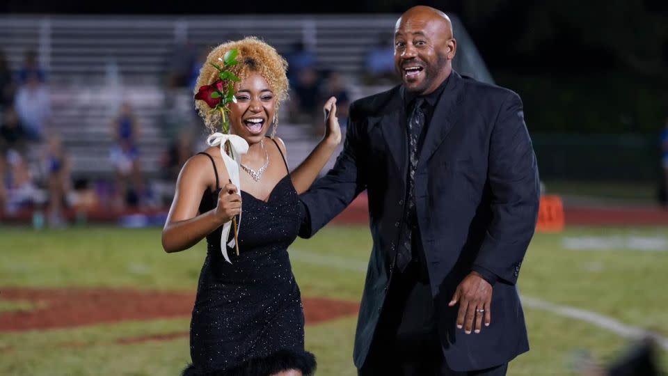 Amber Wilsondebriano pictured at homecoming with her father, Chevalo.  - courtesy Monique Wilsondebriano