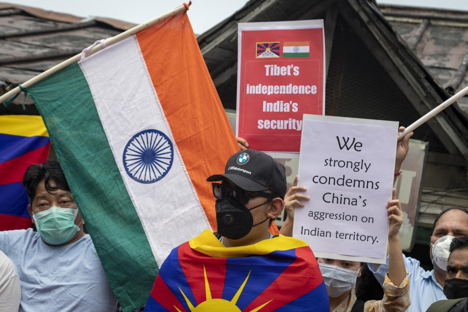 Exile Tibetans and local Indians participate in a protest against the Chinese government, in Dharmsala, India, Friday, June 19, 2020. India said Thursday it was using diplomatic channels with China to de-escalate a military standoff in a remote Himalayan border region where 20 Indian soldiers were killed this week. (AP Photo/Ashwini Bhatia)
