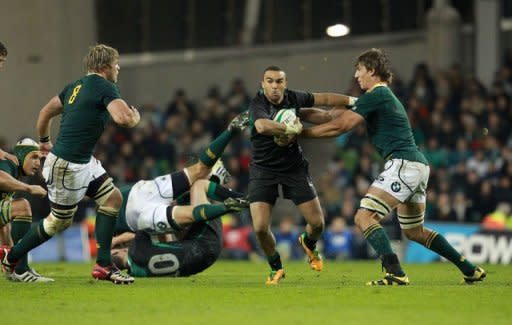 Ireland's full back Simon Zebo (2nd R) hands off South Africa's lock Eben Etzebeth (R) during their Autumn International rugby union match at the Aviva stadium in Dublin. South Africa overturned a first half deficit and ill-discipline to open their November tour of the northern hemisphere with a deserved 16-12 victory