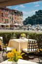 <p>Portofino’s famous piazzetta is where visitors go to see and be seen. The main square is surrounded by bustling restaurants, from traditional eateries like the celebrity favorite <a href="https://www.tripadvisor.com/Restaurant_Review-g187825-d1103834-Reviews-Ristorante_Puny-Portofino_Italian_Riviera_Liguria.html" rel="nofollow noopener" target="_blank" data-ylk="slk:Da Puny;elm:context_link;itc:0;sec:content-canvas" class="link ">Da Puny</a> to small bars like <a href="http://www.barmariucciaportofino.it/" rel="nofollow noopener" target="_blank" data-ylk="slk:Bar Mariuccia;elm:context_link;itc:0;sec:content-canvas" class="link ">Bar Mariuccia</a>, which is the perfect spot to enjoy a morning espresso or an evening apertivo. <a href="https://www.belmond.com/hotels/europe/italy/portofino/belmond-hotel-splendido/dining" rel="nofollow noopener" target="_blank" data-ylk="slk:Chuflay;elm:context_link;itc:0;sec:content-canvas" class="link ">Chuflay</a> restaurant, which is located front and center, recently celebrated its 20th anniversary and boasts a sprawling outdoor terrace with one of the best views of the marina in town. The restaurant serves classic Ligurian dishes, like pasta served with Genoese pesto sauce, traditional fish soup, and warm octopus salad, and it is located inside the <a href="https://www.belmond.com/hotels/europe/italy/portofino/belmond-hotel-splendido/" rel="nofollow noopener" target="_blank" data-ylk="slk:Belmond Splendido Mare;elm:context_link;itc:0;sec:content-canvas" class="link ">Belmond Splendido Mare</a>, which is the sister property of the iconic hilltop hotel. Don’t forget to stop at the nearby <a href="https://www.tripadvisor.com/Restaurant_Review-g187825-d8065989-Reviews-Bar_Gelateria_San_Giorgio-Portofino_Italian_Riviera_Liguria.html" rel="nofollow noopener" target="_blank" data-ylk="slk:Gelateria San Giorgio;elm:context_link;itc:0;sec:content-canvas" class="link ">Gelateria San Giorgio</a> after your meal for a scoop of the best gelato in town.</p>