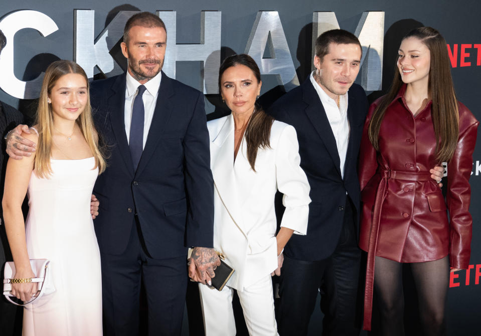Harper Beckham, David Beckham, Victoria Beckham, Brooklyn Beckham and Nicola Peltz attend the Netflix red carpet