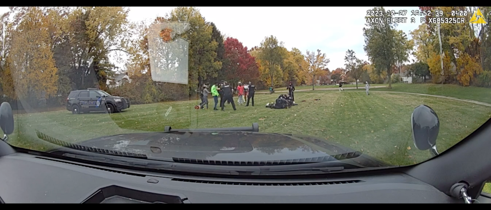 View from an Akron Police Department dash camera of Akron police officers arresting two teens, including a 19-year-old an officer punched in the face, on Oct. 27 at Lawton Street Community Center.