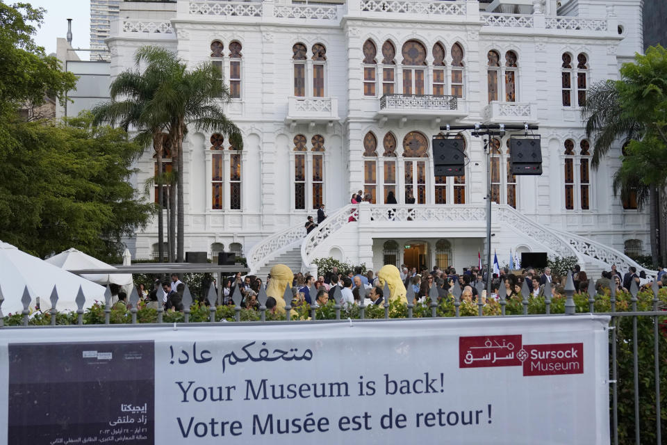 A crowd of people gather at the courtyard of the Sursock Museum during an opening event for the iconic venue in Beirut, Lebanon, Friday, May 26, 2023. The museum has reopened to the public, three years after after a deadly explosion in the nearby Beirut port reduced many of its treasured paintings and collections to ashes. (AP Photo/Hussein Malla)