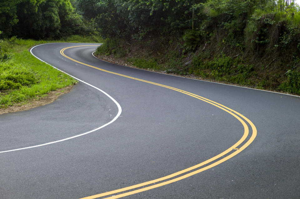 FILE- In this Sept. 24, 2014, file photo, is the curvy Hana Highway in Hana, Hawaii. So many tourists are flocking to Maui now that coronavirus pandemic concerns have eased in the United States that islanders are feeling overwhelmed and Maui's mayor is begging airlines to cut back on the number of people they fly to the island. (AP Photo/Marco Garcia, File)