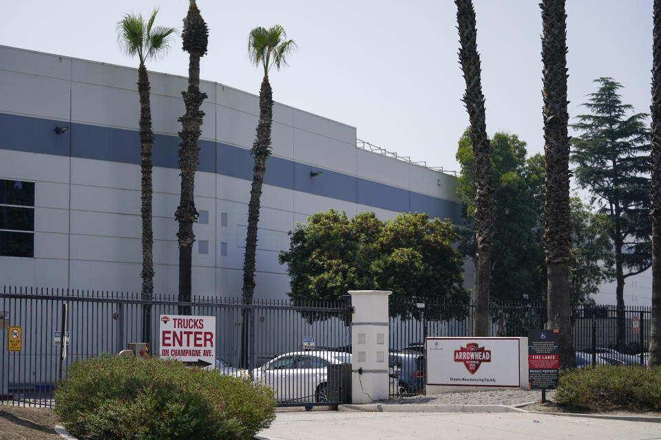 The entrance to a manufacturing facility for BlueTriton, the company that produces the widely-known Arrowhead brand of bottled water, appears on Friday, Sept. 15, 2023, in Ontario, Calif. The State Water Resources Control Board is expected to vote Tuesday on whether to issue a cease-and-desist order against BlueTriton. The order would prevent the company from drawing water from certain points in the San Bernardino National Forest. (AP Photo/Ashley Landis)