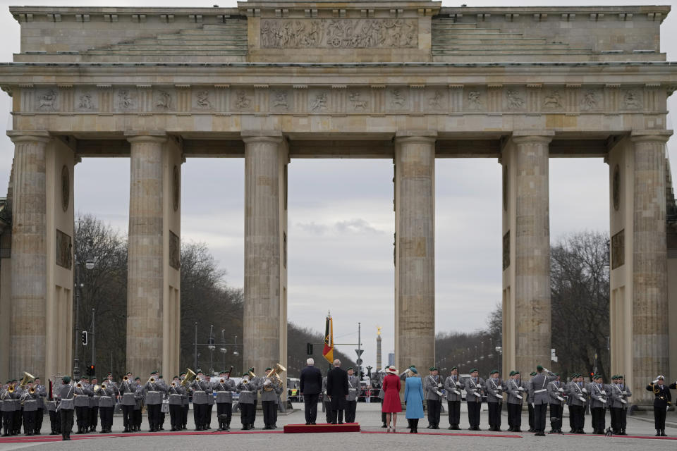 German President Frank-Walter Steinmeier, center left, with his wife Elke Buedenbender, welcome Britain's King Charles III and Camilla, the Queen Consort, right, in front of the Brandenburg Gate in Berlin, Wednesday, March 29, 2023. King Charles III arrived Wednesday for a three-day official visit to Germany. (AP Photo/Matthias Schrader)