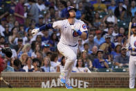 Chicago Cubs' Ian Happ watches his single against the Boston Red Sox during the sixth inning of a baseball game in Chicago, Saturday, July 2, 2022. (AP Photo/Nam Y. Huh)