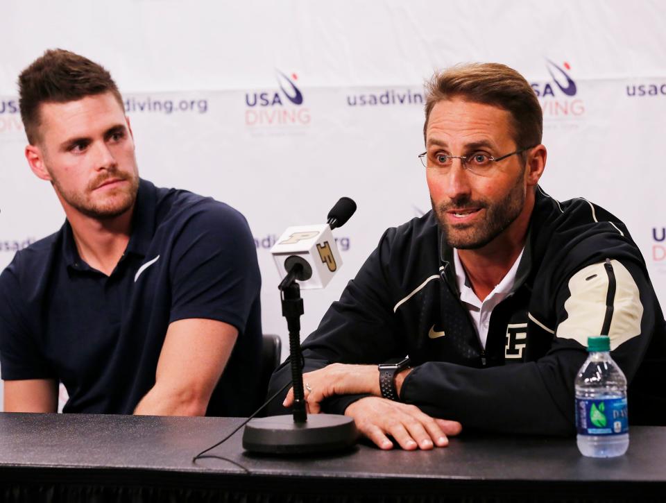 Olympic gold medalist diver and former Purdue standout David Boudia, left, listens as his coach Adam Soldati comments after Boudia’s announcement that he will continue training with the goal of the Tokyo Olympic in 2020 during a press conference Tuesday, September 12, 2017, on the campus of Purdue University.