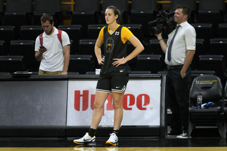 Iowa guard Caitlin Clark stands on the court during practice after Iowa's NCAA college basketball media Oct. 4, 2023, in Iowa City, Iowa. Clark is embracing her role as an ambassador for the game after she led Iowa to the NCAA championship game last season. She enters this season with 90 straight double-figure scoring games and a 27.3-point career average. (AP Photo/Charlie Neibergall)