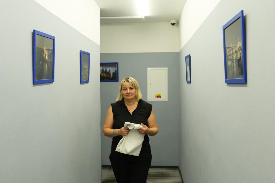 Ukrainian refugee Liudmyla Chudyjovych walks along a corridor in a hotel where she works, Wednesday, Aug. 3, 2022, in Prague, Czech Republic. Nearly six months after the Russian invasion of Ukraine, many refugees are still struggling to find jobs in their European Union host countries, despite the EU's streamlined process for Ukrainians to live and work in any of its 27 member nations. (AP Photo/Petr David Josek)