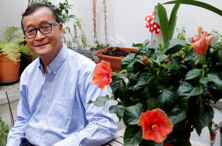 Former president of the dissolved opposition Cambodia National Rescue Party (CNRP) Sam Rainsy, who is living in exile, poses on his terrace in Paris, France, July 19, 2018. REUTERS/Philippe Wojazer