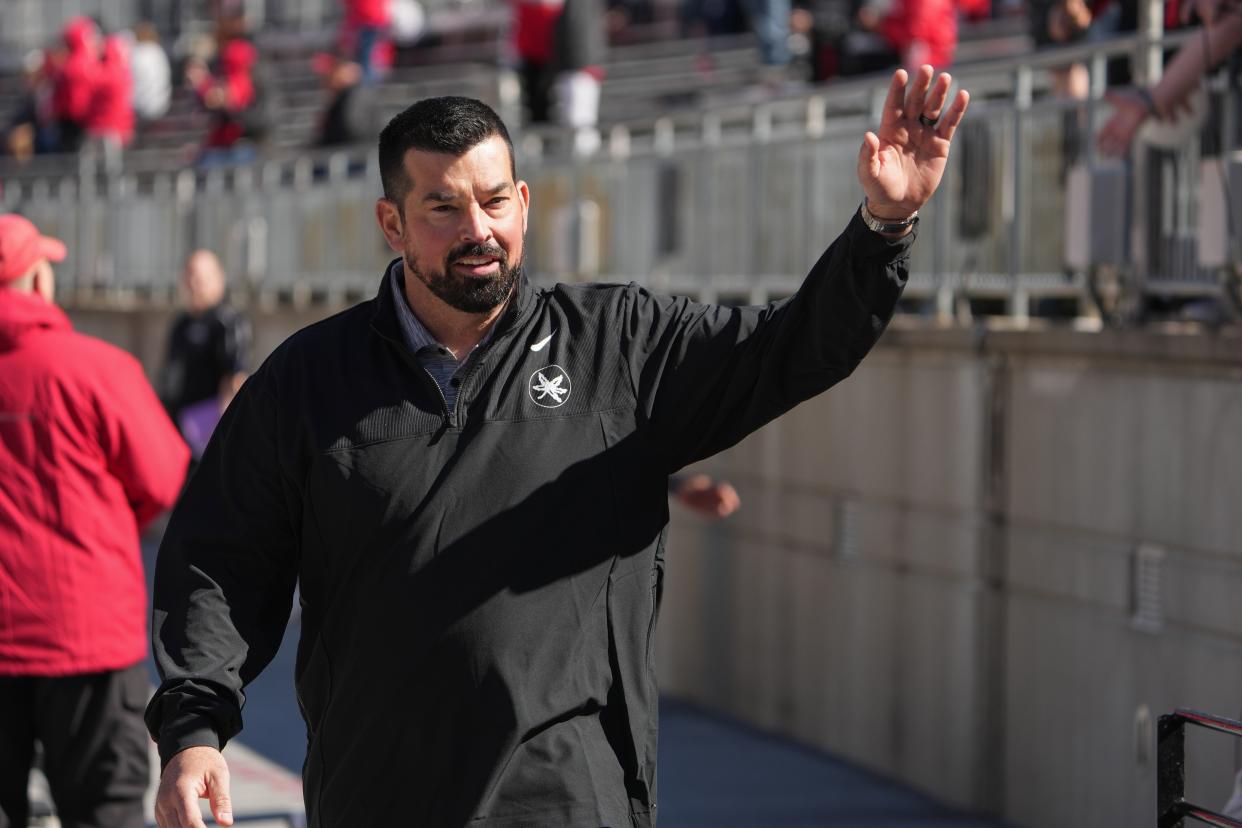 Apr 13, 2024; Columbus, OH, USA; Ohio State Buckeyes head coach Ryan Day waves to fans as he walks into Ohio Stadium before the Ohio State football spring game at Ohio Stadium.