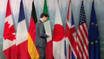 Canada's Prime Minister Justin Trudeau leaves a press conference at the G7 Summit in the Charlevoix town of La Malbaie, Quebec, Canada, June 9, 2018. REUTERS/Christinne Muschi