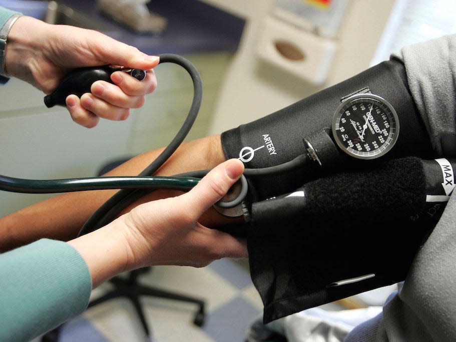 Doctors read someone's blood pressure