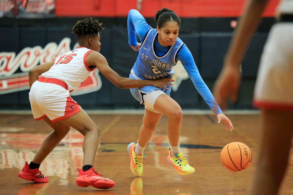 St. Johns Country Day's Taliah Scott (2) dribbles past Terry Parker's A'shiana Christian (15) during the third quarter.