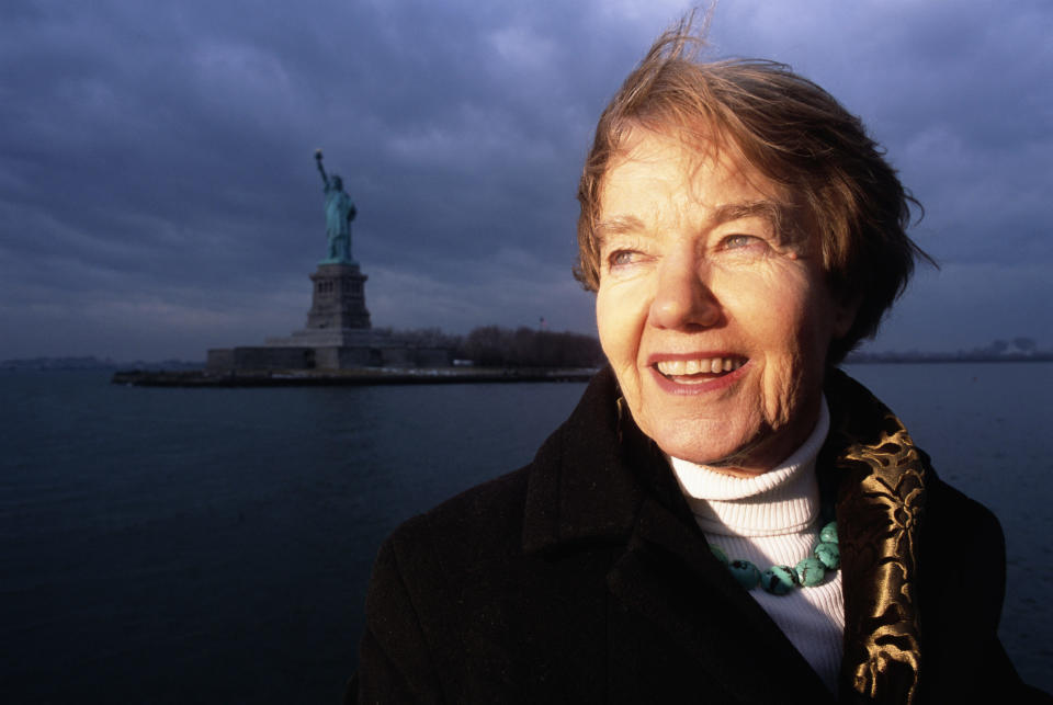 Joy Hakim poses near the Statue of Liberty in 2003 when a TV special based on her 10-book series on the history of the United States was airing on PBS stations (Mark Peterson/Getty Images)