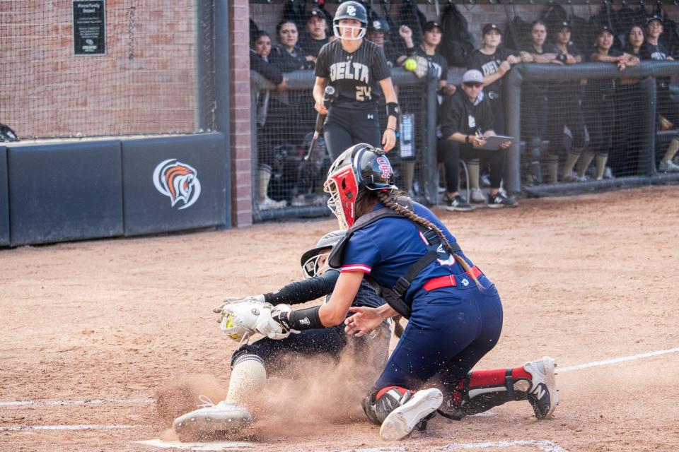 Tara Fornaciari (bottom) out at home plate by Santa Rosa’s Adriana Novak during the softball game at the University of the Pacific in Stockton, CA. on March 26, 2024.