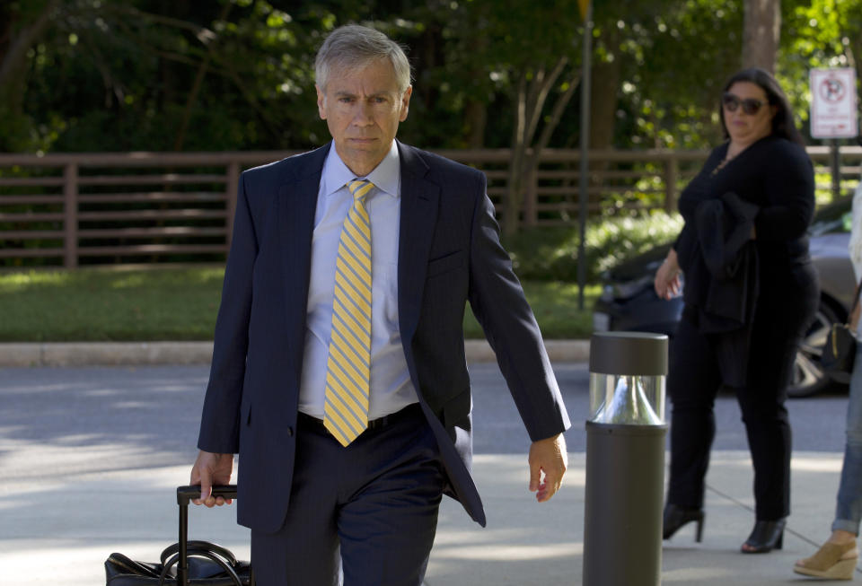 Lee Elbaz's attorney Barry Pollack arrives at federal court for jury selection in her trial in Greenbelt, Md., Tuesday July 16, 2019. Elbaz was CEO of an Israel-based company called Yukom Communications. She is accused of engaging in a scheme to dupe investors through the sale and marketing of financial instruments known as "binary options." (AP Photo/Jose Luis Magana)