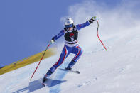France's Romane Miradoli speeds down the course during an alpine ski, women's World Cup super-G, in Lenzerheide, Switzerland, Saturday, March 5, 2022. (AP Photo/Alessandro Trovati)