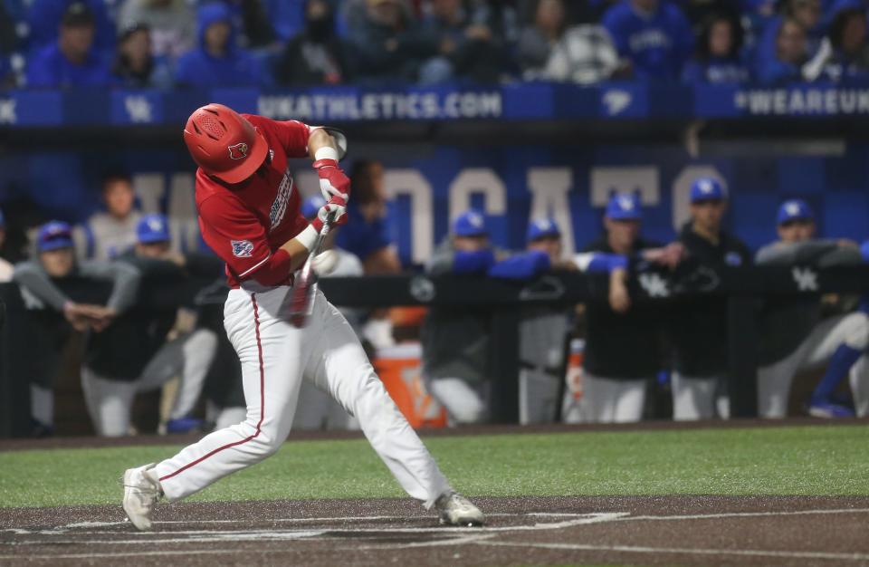 Louisville’s Jack Payton gets a single and knocks a run in against Kentucky on April 25, 2023.