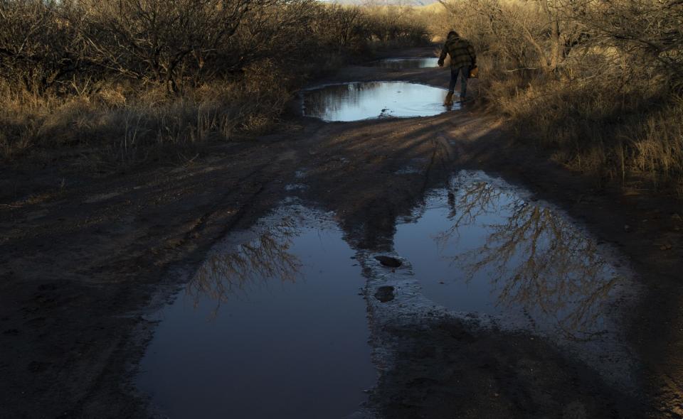 Kate Scott, a conservation activist, walks through lowlands along the San Pedro River, which crosses U.S.- Mexico border.