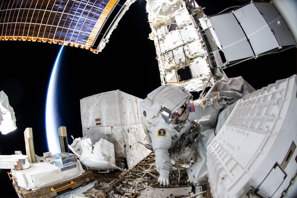 Astronaut Kayla Barron performs a spacewalk to repair a damaged antenna in early December.