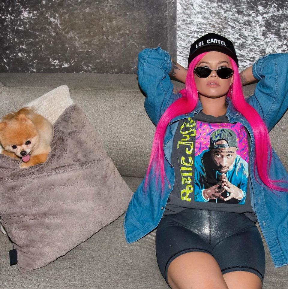 Chanel West Coast poses with pink hair